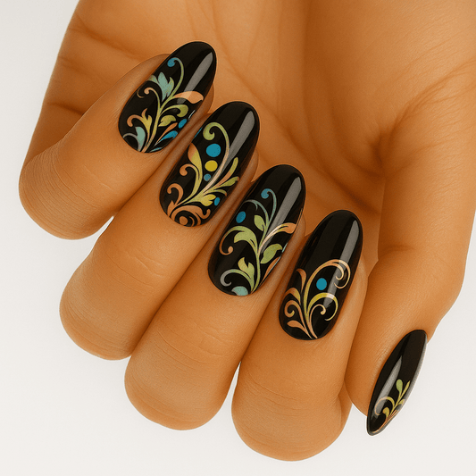 Black gel nail wraps with ornate gold baroque scrollwork pattern on hand manicure