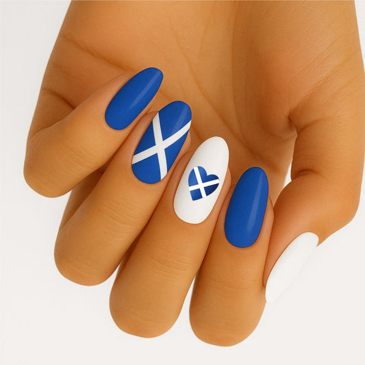 Blue and white Scottish flag nail wraps on hand showing patriotic nail art design