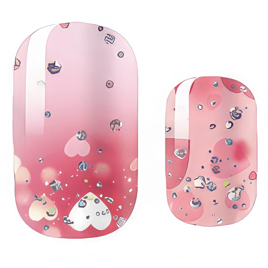 Pink ombre nail wraps with heart glitter pattern and metallic accents