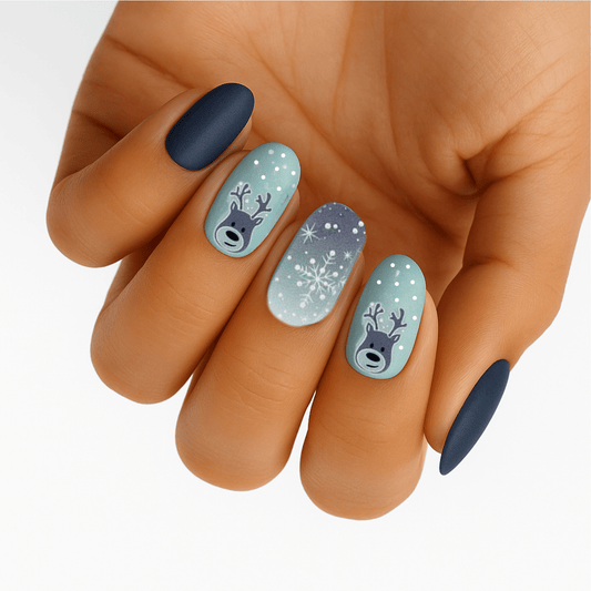 Winter nail art on hand featuring blue matte and light blue gel wraps with reindeer design