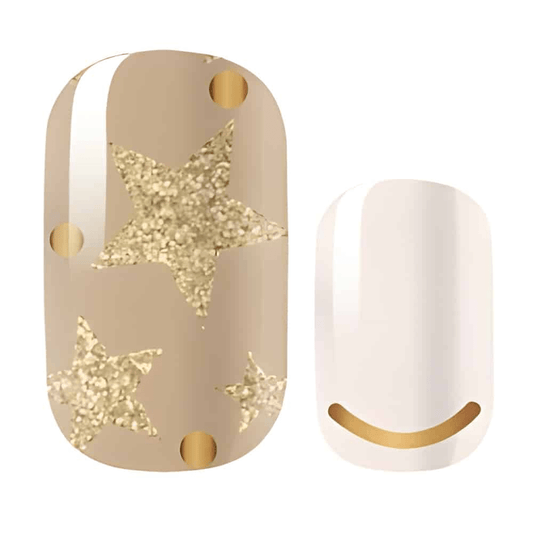 Champagne nail wraps with gold glitter stars on neutral background celestial pattern design