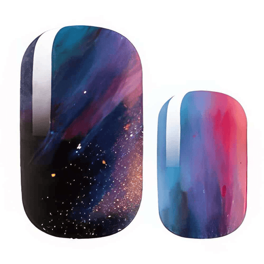 Galaxy nail wraps with cosmic purple blue gradient and sparkle stardust pattern