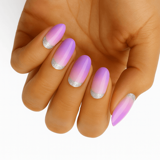 Hand wearing pink holographic glitter ombre nail wraps with silver tips