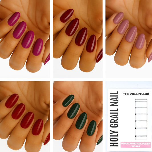 Multicoloured gel nail wraps on hands showing burgundy, purple, green and pink glossy finishes