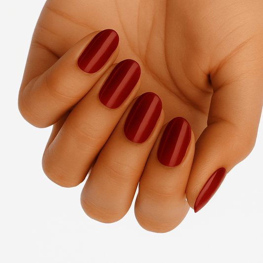 Hand displaying glossy red wide fit nail wraps in classic vermillion shade