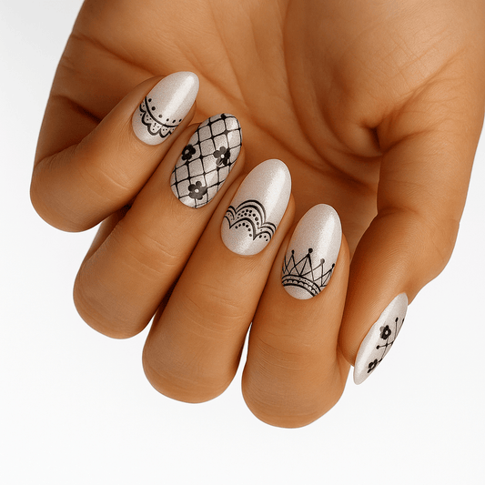 Black lace pattern nail wraps on hand showing Victorian vintage nail art design