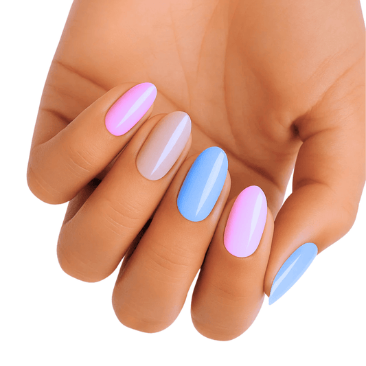 Hand wearing pastel nail wraps in soft pink, blue and white colours
