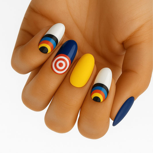 Colourful target pattern nail wraps on hand featuring blue yellow white geometric nail art designs