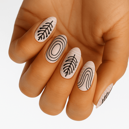Nude nail wraps with black zen garden patterns on hand showing minimalist nail art