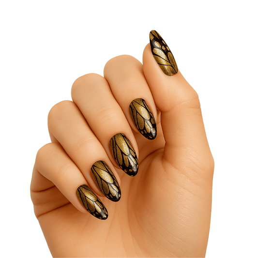 Hand wearing gold and brown butterfly wing gel nail wraps with metallic finish