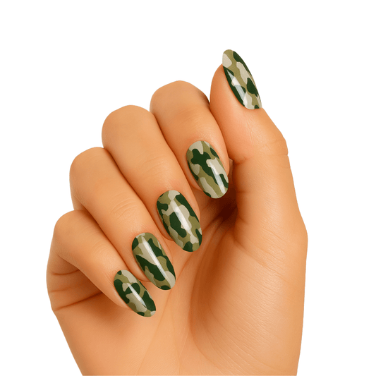 Green camouflage pattern gel nail wraps displayed on hand for at-home manicure