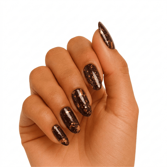 Bronze holographic glitter gel nail wraps on hand showing sparkling metallic finish manicure