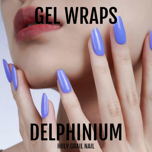 Purple blue gel nail wraps on hand showing glossy Delphinium manicure finish
