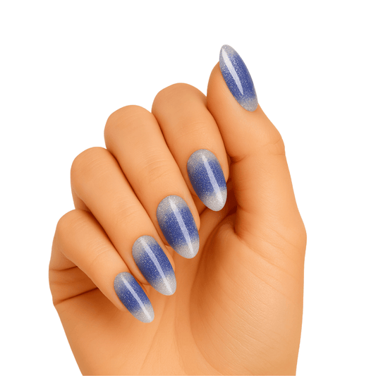 Blue shimmer gel nail wraps on hand showing frosty winter manicure with sparkle finish