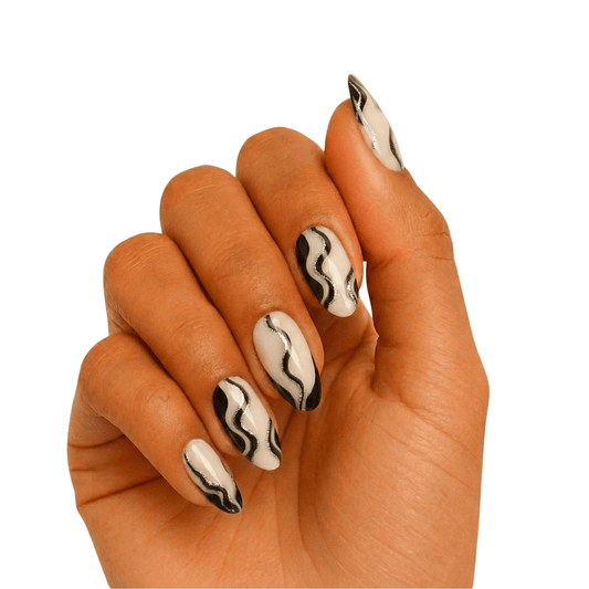 Black and white smoke pattern gel nail wraps on hand