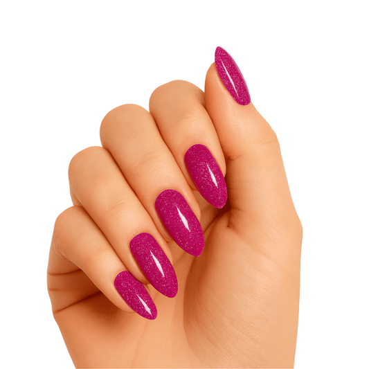 Hand wearing hot pink glittery gel nail wraps with sparkly metallic finish