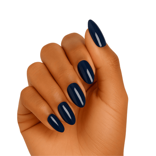 Navy blue gel nail wraps on hand showing glossy finish at-home manicure