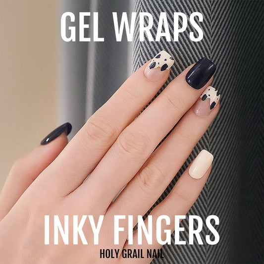 Black and cream gel nail wraps with abstract ink pattern on hand