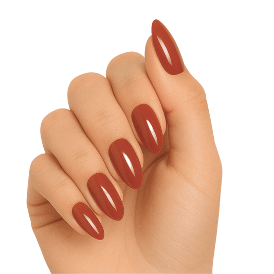 Glossy terracotta brown gel nail wraps on hand showing warm autumn manicure