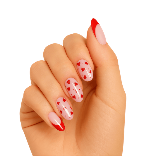 Hand with glossy pink gel nail wraps featuring red heart pattern and red accent nails