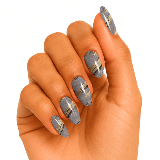 Grey marble gel nail wraps with gold veining on hand manicure
