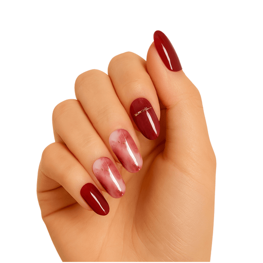 Hand wearing red chrome gel nail wraps with metallic shimmer finish manicure