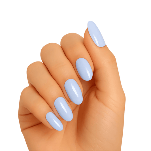 Hand wearing powder blue gel nail wraps in glossy sea foam shade for at-home manicure