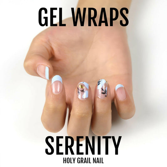 Serenity gel nail wraps on hand featuring white base with delicate floral botanical designs
