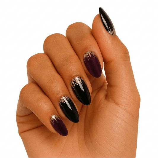 Dark burgundy and black gel nails with gold glitter accent on hand