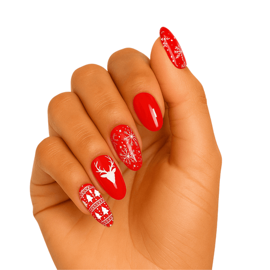 Red Christmas gel nail wraps on hand with reindeer patterns and festive designs