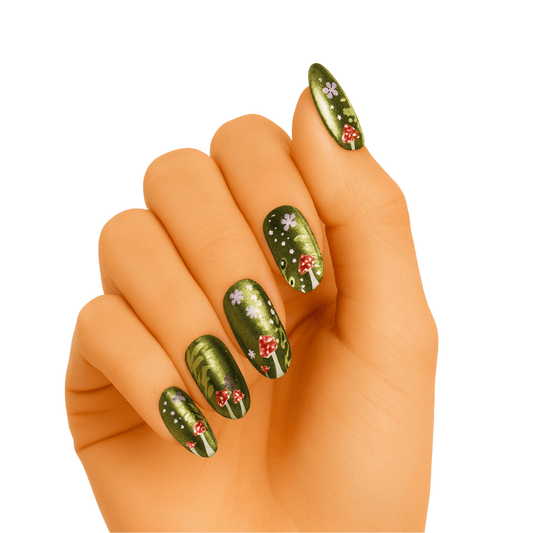 Green gel nail wraps with red mushroom toadstool pattern on hand