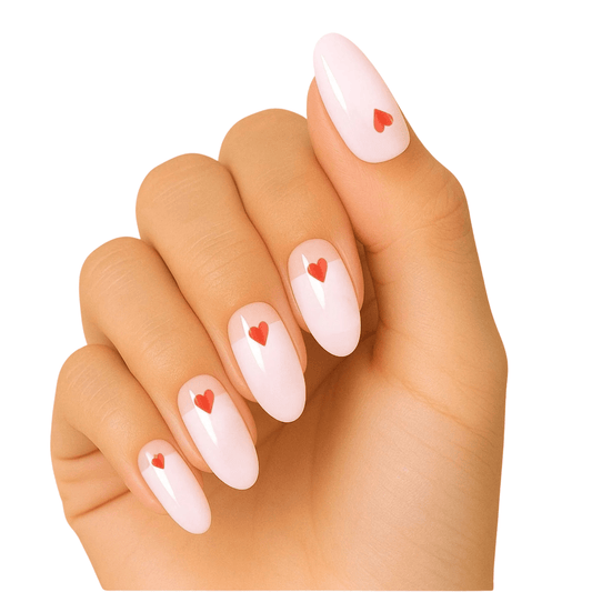 Pink gel nail wraps with red hearts pattern on hand perfect for romantic manicure