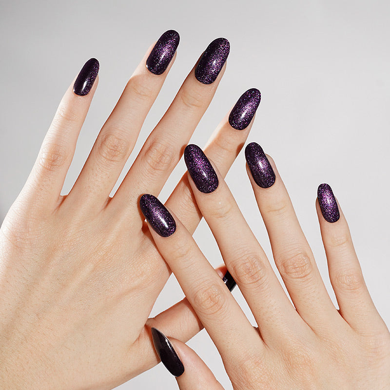 Dark purple shimmer semi-cured gel nail wraps with cat's eye magnetic effect, almond shape