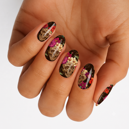 Black semi-cured gel nail wraps with floral sugar skull design and gold accents.