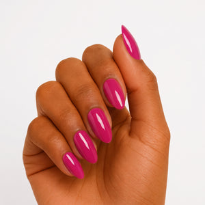 Glossy magenta pink semi-cured gel nail wraps on almond-shaped nails