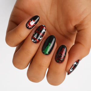 Black nail wraps with Santa, reindeer plaid, and green Christmas tree designs