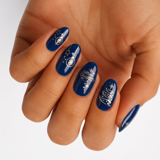 Navy blue glossy nail wraps with gold stars, baubles and "Merry Christmas" lettering