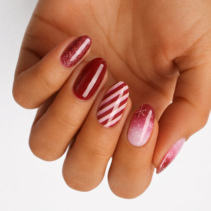 Holy Classics nail wraps in red glitter, candy-cane stripes and pink snowflake designs
