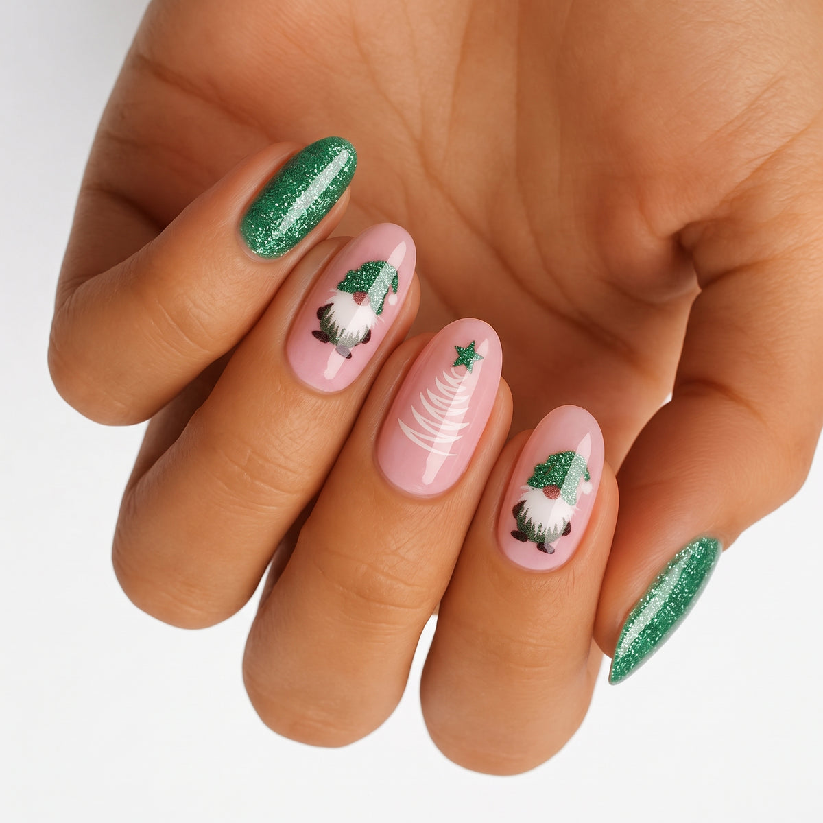 Nail wraps with green glitter tips, pink base, gnome and Christmas tree design