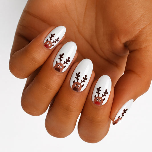 White glossy nail wraps with cartoon reindeer faces and antlers, festive Christmas design