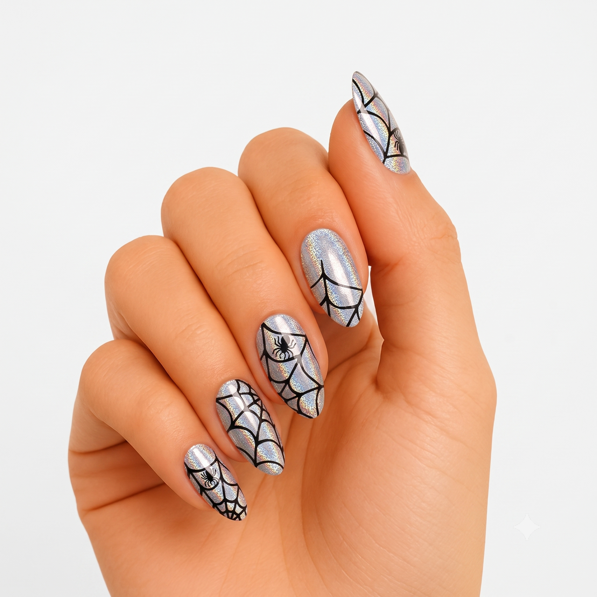 Silver holographic press-on nails with black spiderweb and spider Halloween design