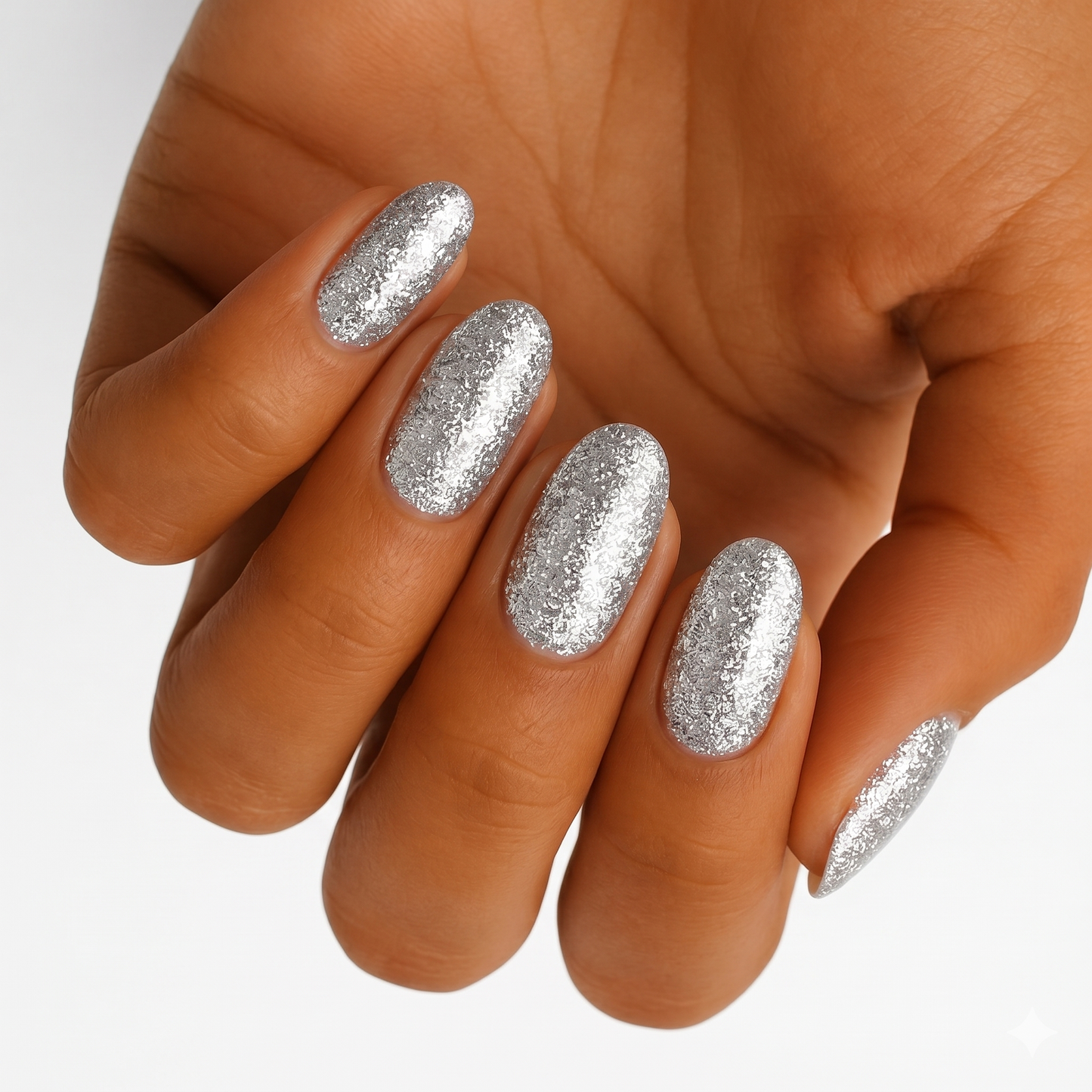 Silver glitter nail wraps on hand with sparkly metallic finish for party look