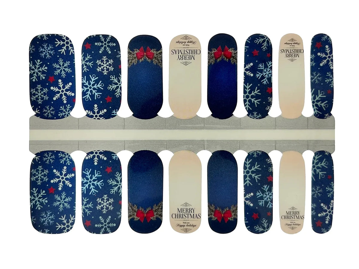 Navy blue nail wraps with white snowflakes, red bows and "Merry Christmas" text