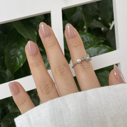 Glossy mauve-pink semi-cured gel nail wraps in a solid, glossy finish, almond shape