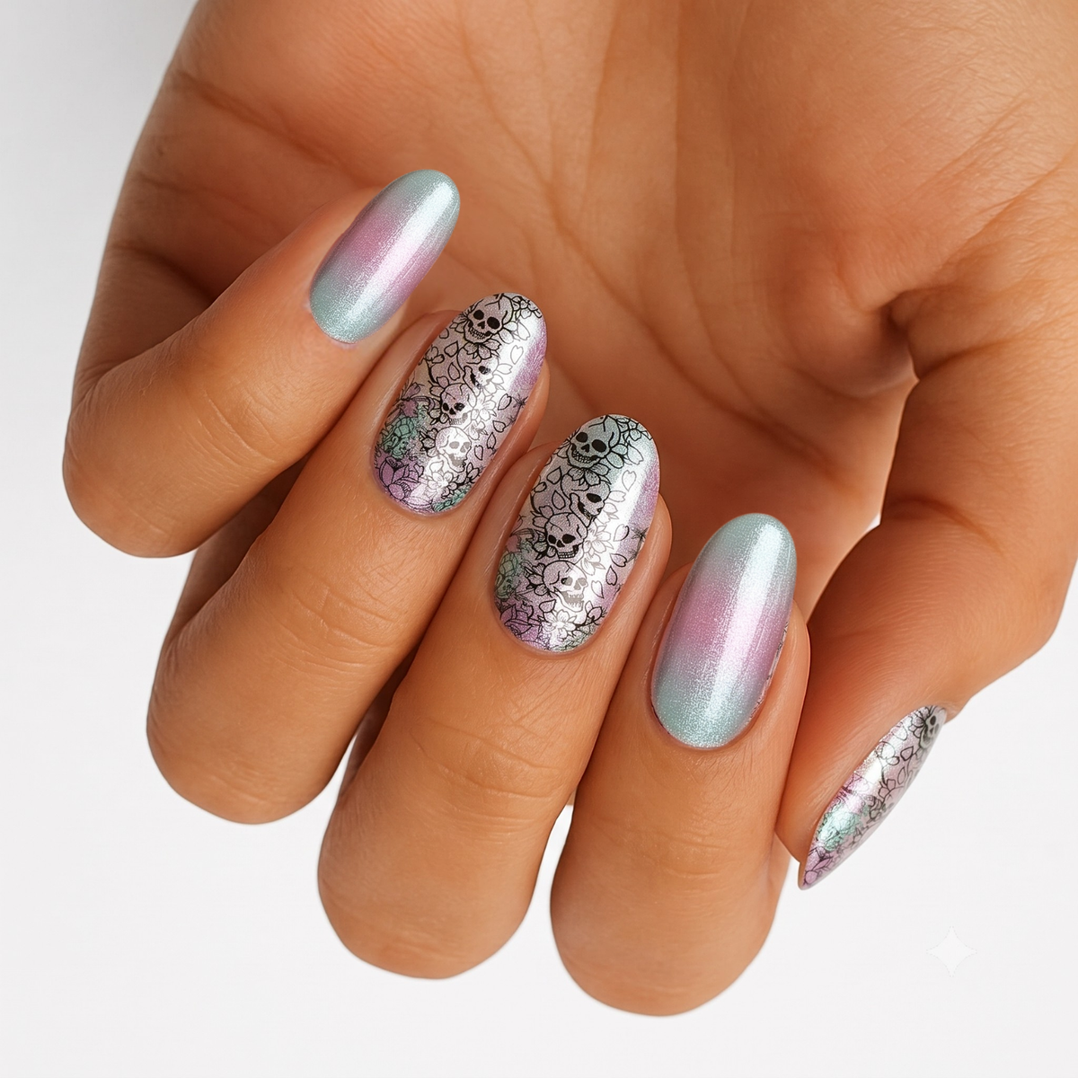 Pink-green shimmer ombré nail wraps with black skull and floral lace design