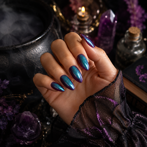 Almond press-on nails in shimmering blue-green to purple color-shifting chrome finish.