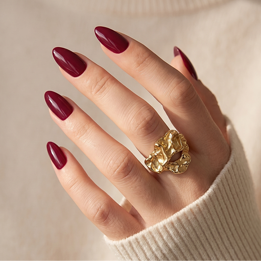 Deep wine red glossy semi-cured gel nail wraps on almond-shaped nails