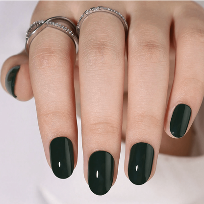 Dark forest green glossy semi-cured gel nail wraps on short round nails