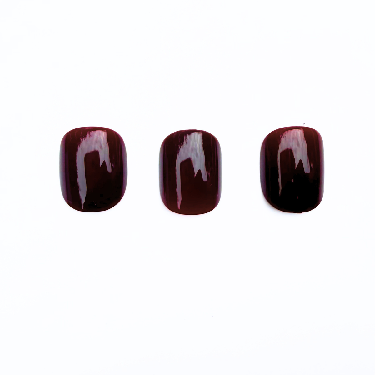 Deep oxblood red glossy soft gel press-on nails, extra short natural shape