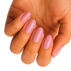 Solid dusty pink glossy semi-cured gel nail wraps on almond-shaped nails